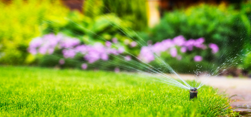 sprinkler system watering the lawn