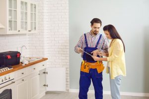 a person talking to a plumber