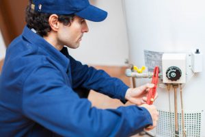 Plumber fixing an hot-water heater San Marcos, CA