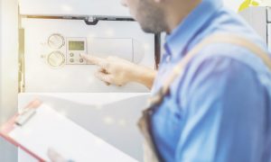 plumber installing a tankless water heater