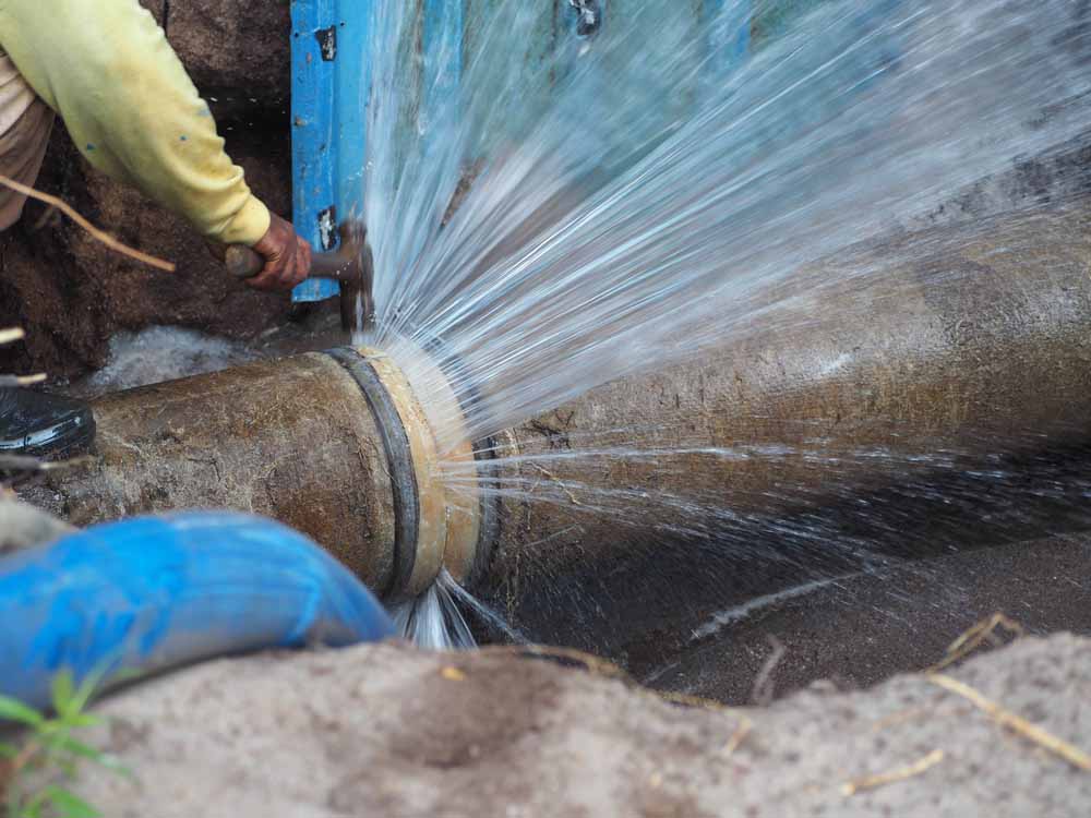 plumber fixing a burst pipe Murrieta, CA