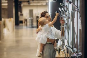 mother and daughter choose a water-efficient shower fixtures